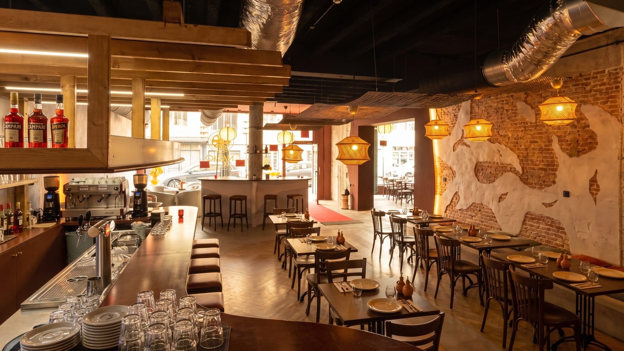 The dining room at Nano Pizza, tables laid before service