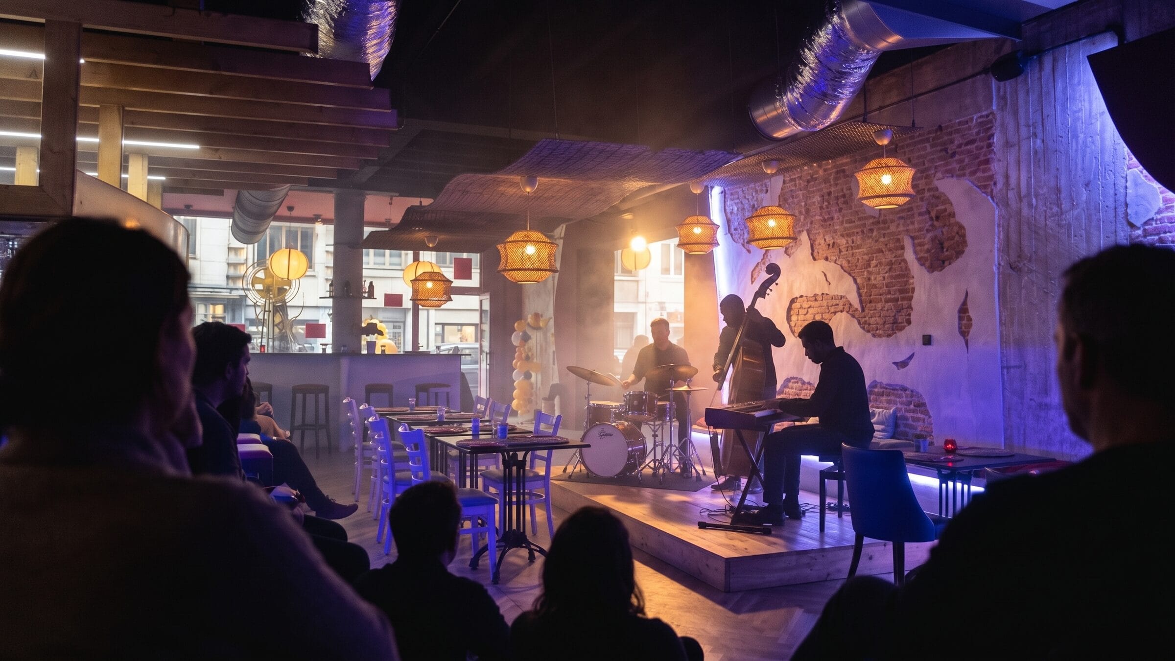 A jazz trio on the stage at Nano Pizza on a live music night